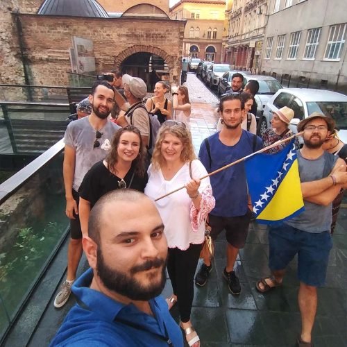 Travelers exploring Sarajevo on a free walking tour