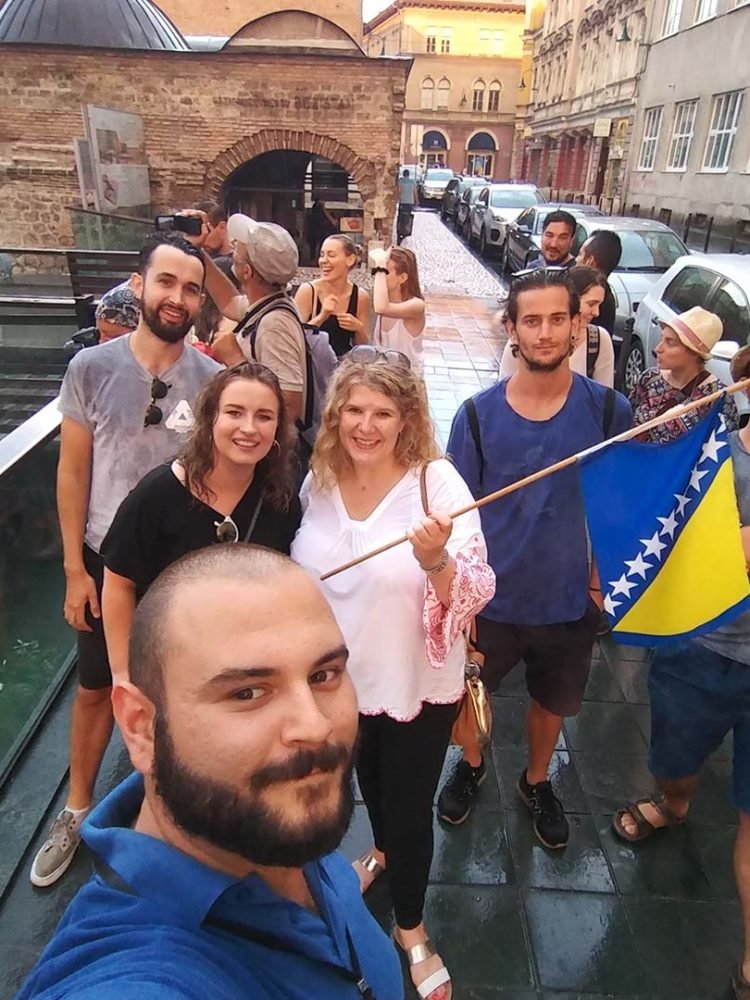 Travelers exploring Sarajevo on a free walking tour